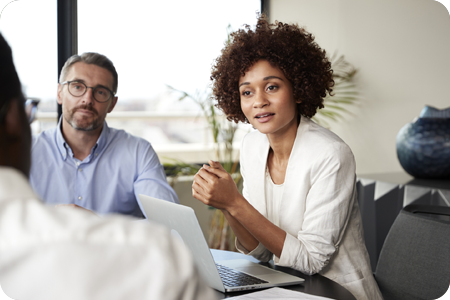 Female business woman sat in an office boardroom